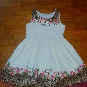 A white dress with a flower design